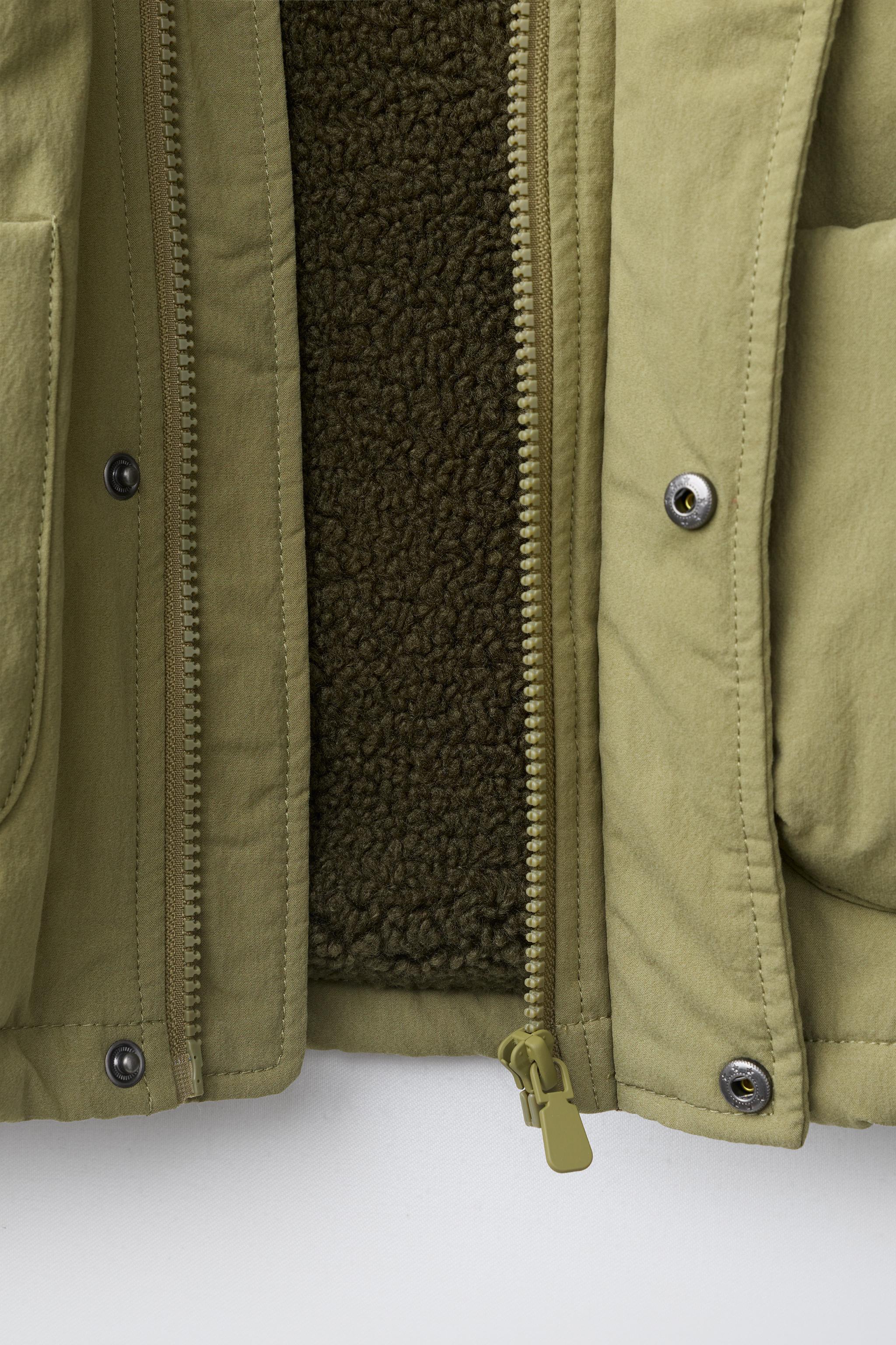 BLOUSON À CAPUCHE EFFET MOUTON